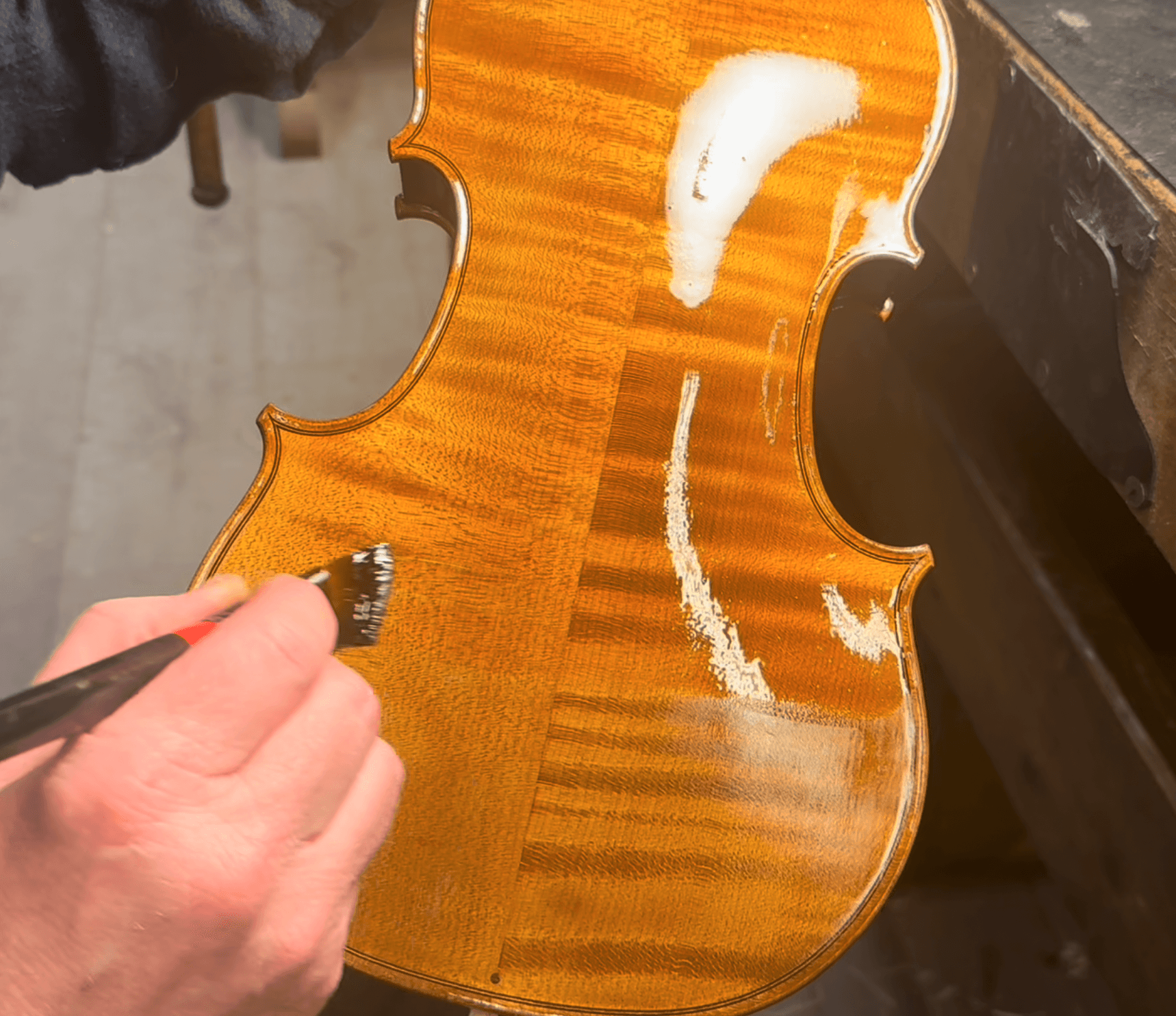 Varnish drying on a finished violin body